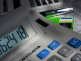 calculator with bills and checks